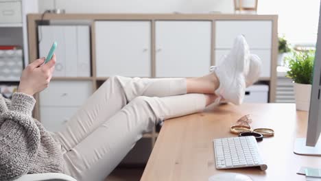 Young-Woman-Procrastinates-Scrolling-her-Smartphone