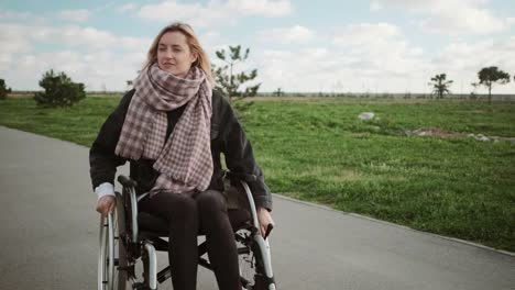 Lonely-disabled-woman-in-wheelchair-outdoors