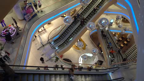 Kiev,-Ukraine,-Europe---October-2019:-Central-Shopping-Center.-Many-people-ride-multiple-excavators-at-the-same-time.-A-lot-of-reflective-balls.-A-lot-of-disco-balls.