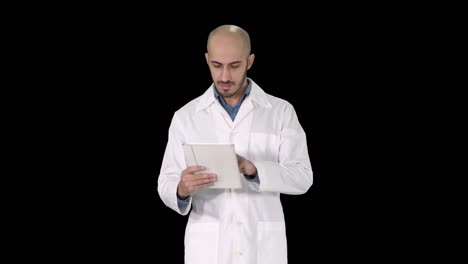 Mature-male-doctor-holding-digital-tablet-using-it-and-walking,-Alpha-Channel