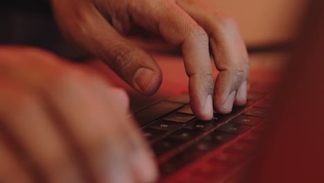 Male-hands-typing-on-a-laptop-keyboard