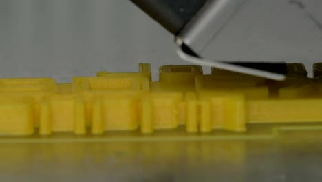 Close-up-view-of-printing-plastic-model-on-a-3D-printer-in-process