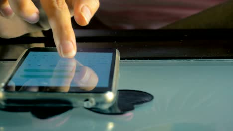 Close-up-of-a-hand-of-a-young-girl-writes-a-message-to-her-friend-on-the-smart-phone.