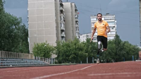 Paralympic-Athlete-Running-on-Stadium-towards-Camera