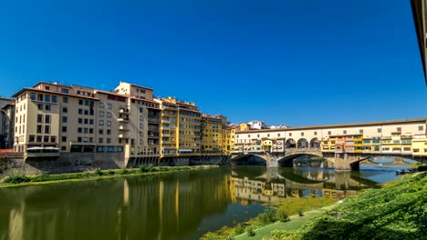 View-on-The-Ponte-Vecchio-on-a-sunny-day-timelapse-hyperlapse,-a-medieval-stone-segmental-arch-bridge-over-the-Arno-River,-in-Florence,-Italy