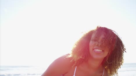 Portrait-of-Ethnic-female-in-sundress-on-beach