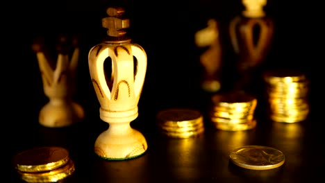 Chess-and-stack-of-coins-in-concept-of-money-power-or-saving-money,-financial-growth,-strategy-investment,-retirement