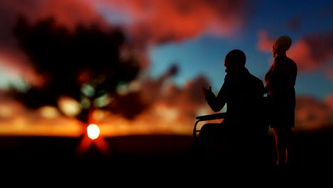 Senior-couple-enjoying-sunrise-on-green-meadow-with-oak-tree,-time-lapse-clouds,-zoom-out