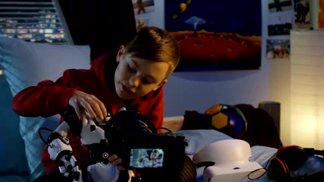 Boy-filming-review-of-toy-robot