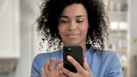 Portrait-of-African-Woman-Using-Smartphone