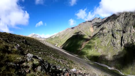 Timelapse-gorge-cliffs-and-mountain-river-with-moving-sky-shadows