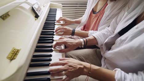 Girlfriends-playing-on-piano