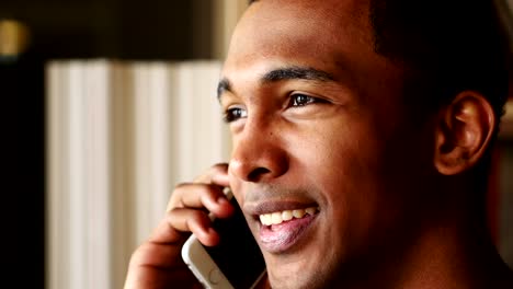 Talking-on-Phone,-Young-Afro-American-Man,-Side-View