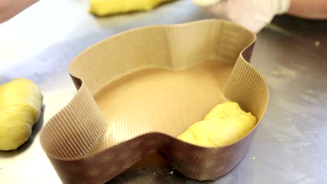 pastry-chef-hands-preparing-the-dough-for-Easter-cake-doves