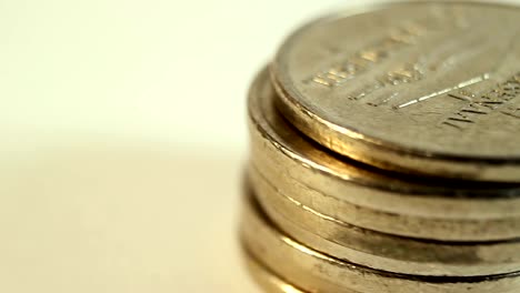 Rotated-coins-on-white-background