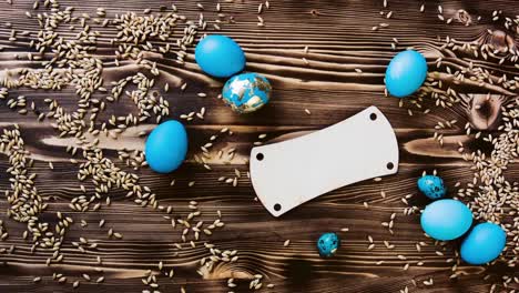 Easter-eggs-painted-in-blue-on-wooden-board-background-with-space-vintage-toned.