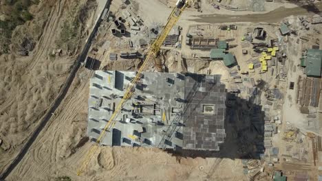 Aerial-view.-Construction-of-a-modern-district-with-residential-apartments-and-developed-infrastructure.-A-construction-site-with-cranes-and-tall-buildings.-Sale-and-rental-of-real-estate