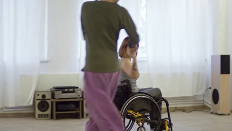 Woman-in-Wheelchair-Performing-Romantic-Dance-with-Partner