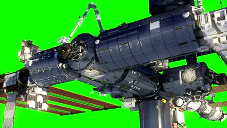 Flight-Of-International-Space-Station-In-Outer-Space.-Green-Screen.