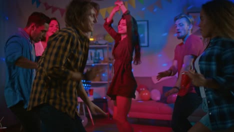 At-the-College-House-Party:-Diverse-Group-of-Friends-Have-Fun,-Dancing-and-Socializing.-Boys-and-Girls-Dance-in-the-Circle.-Girl-Takes-Glass-with-Drink-from-the-Tray-and-Joins-the-Group.