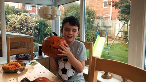 Happy-family-carving-pumpkins-for-a-Halloween-party