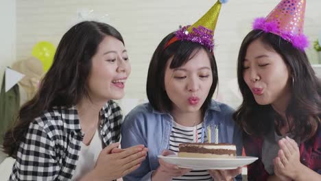 beautiful-girls-blowing-candles-together