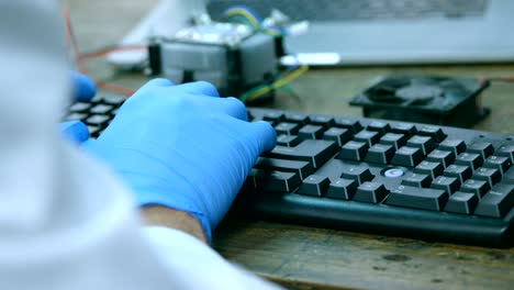 Close-up-of-robotic-engineer-using-desktop-pc-at-desk-4k