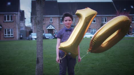 4K-Party-10-Birthday-Boy-Posing-Outdoors-with-Ballons