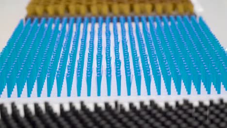 Array-of-blue-spikes-feathers-on-the-white-platform