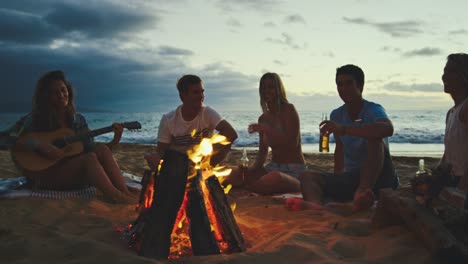 Friends-Relaxing-at-Bonfire-Beach-Party