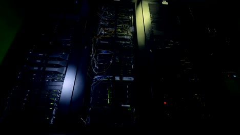 Network-servers-in-a-data-center.-Dark-server-room.