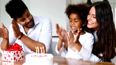 Happy-family-celebrating-birthday-of-their-child