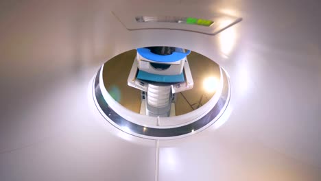 Young-woman-on-a-magnetic-resonance-imaging-MRI-scan-in-a-modern-hospital.