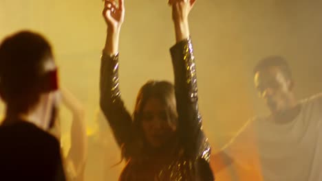 Woman-in-Glitter-Dress-Dancing-at-Party