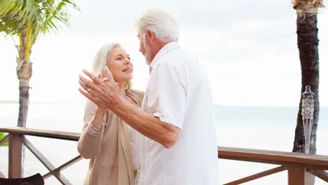 Retired-Caucasian-couple-evening-dancing-at-vacation-hotel