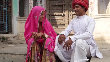 Tilt-up-of-a-smart-and-elegantly-dressed-Indian-couple-in-traditional-wear