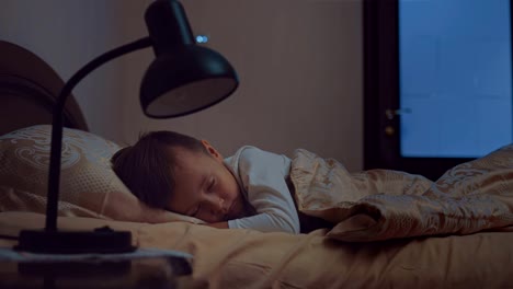 Sleeping-baby-is-happy-and-carefree-in-his-bed