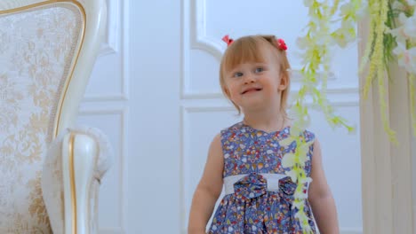 Portrait-of-funny-little-girl-at-home