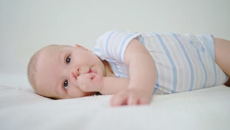 Cute-Baby-Lying-in-Her-Bed-at-Home