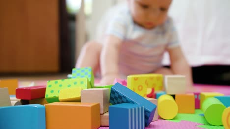 Cute-Baby-Playing-on-the-Floor-at-Home