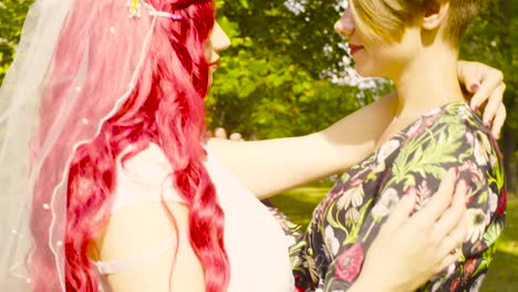 Lesbian-wedding.-The-bride-and-groom-are-hugging-each-other-and-talking