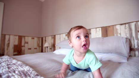 Baby-boy-adventurer-crawling-and-exploring-the-bed