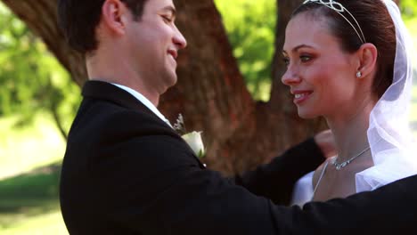 Groom-lifting-his-brides-veil-and-kissing-her