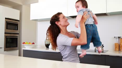 Happy-mother-playing-with-baby-boy