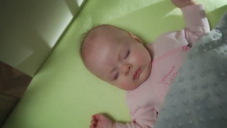 Top-View-of-Sleeping-newborn-baby-dolly-shot