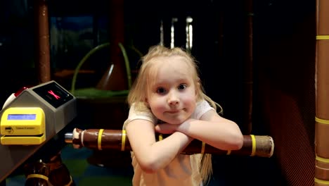 4K-Portrait-of-a-cute-little-girl-bored-in-the-entertainment-center.