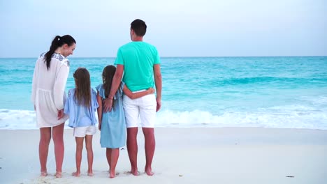 Young-family-on-vacation-on-the-beach.-Family-travel-concept