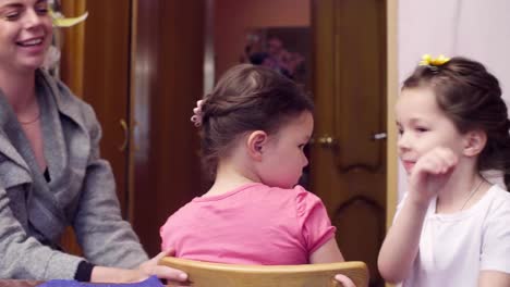 Two-sisters-playing-in-the-kitchen