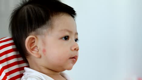 cute-asian-baby-boy-happy-eating-food-with-mom