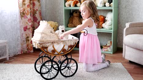 girl-dolls-placed-in-a-stroller-on-the-background-of-shelves-with-toys